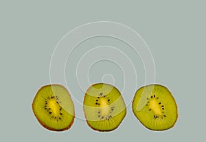 Sliced kiwi isolated on blue background. Copyspace for text