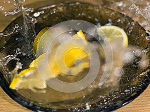 Sliced Kiwi Lemon and Orange with waterdrops