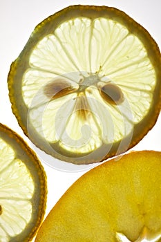 Sliced Lemon and Apple isolated on white