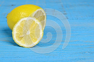 Sliced lemon on blue wood