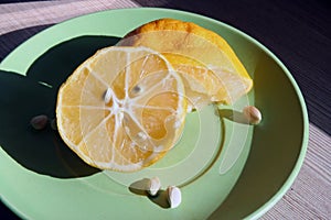 Sliced lemon. Home made lemon slices. Lemon slices on a saucer.