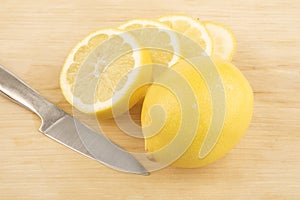 Sliced lemon and knive photo