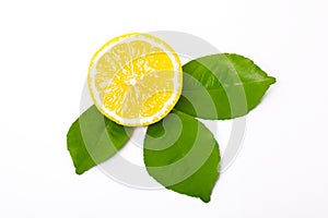 Sliced lemon and lemon leaves