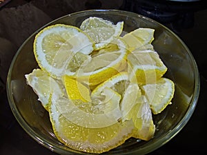 Sliced lemon slices with sugar for tea. The preparation of lemons is a simple and delicious delicacy that retains its aroma