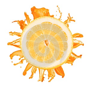 Sliced lemon splash with orange juice isolated