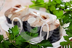 Sliced lightly salted mackerel fish served with onion and greens