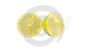 Sliced lime isolated with water splash