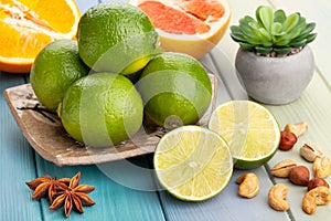 Sliced lime on a plate on wood