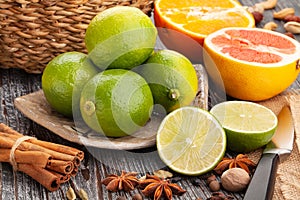 Sliced lime on a plate on wood