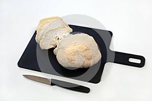 Sliced Lions mane mushroom on cutting board