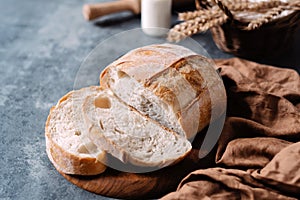 Sliced loaf of freshly baked homemade on the table. French bread. Healthy eating, sourdough bread