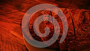 Sliced Loaf On Table In Firelight