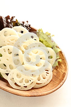 Sliced loutus roots on wooden plate