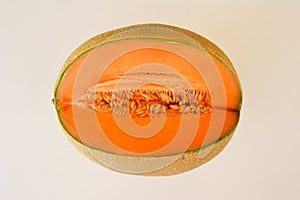 Sliced melon over a white background.