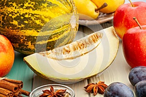 sliced melon on wood