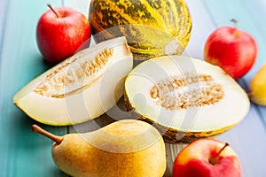 sliced melon on wood