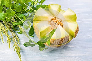 Sweet melon half on the wood