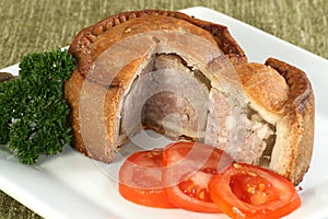 Sliced melton mowbray pork pie photo