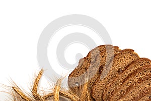 Sliced Multigrain. Rye bakery with crusty loaves and crumbs. Fresh loaf of rustic traditional bread with wheat grain ear