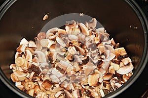 Sliced mushrooms in a slow cooker