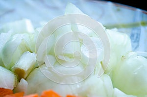 Sliced onions. A plate with vegetables. Diced onions close-up. Healthy diet. Proper nutrition. Vegetables. Natural products.