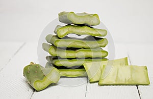 Sliced opuntia ficus-indica cactus leaf on a white background