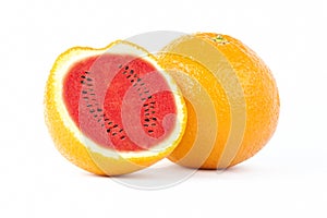 Sliced orange fruit with watermelon photo manipulation isolated on white