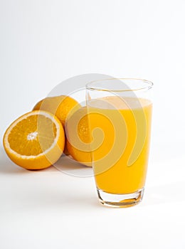 Sliced orange and a glass of orange juice