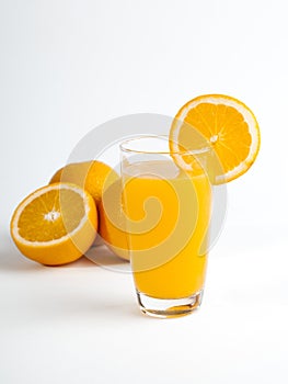 Sliced orange and a glass of orange juice