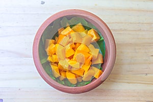 Sliced orange mango fruit pieces