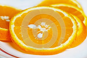 Sliced orange slices on a plate, citrus fruits