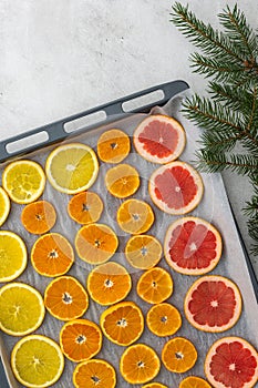 Sliced citrus on baking sheet