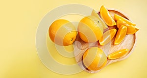 Sliced Orange on Wooden Plate. Fresh Juicy Fruit in Summer. Top View. Flat Lay