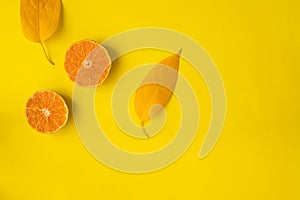 Sliced orange on yellow background