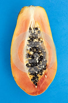 Sliced papaya on a blue background