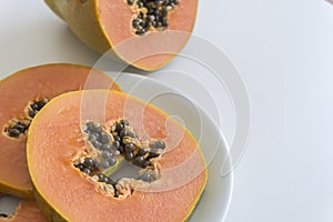 Sliced papaya on white background