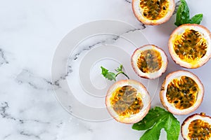 Sliced passion fruit on marle background.