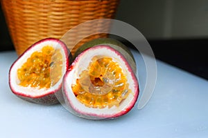 Sliced passion fruits with wood basket