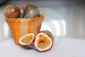 Sliced passion fruits with wood basket