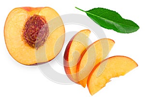 Sliced peach fruit with green leaf isolated on white background. clipping path