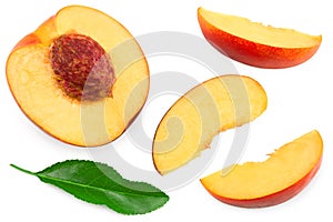 Sliced peach fruit with green leaf isolated on white background. clipping path. top view