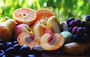 sliced peaches and pears, grapes and cherry