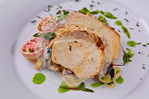 Sliced peanut crusted chicken breast with fresh salad and sauce