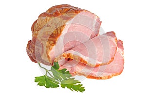 Sliced a piece of bacon and green leaf of parsley isolated on white