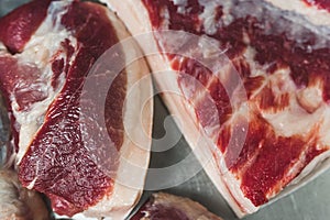 sliced pieces of pork on the table, closeup shot, slaughterhouse