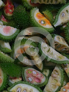 Sliced pieces of spiny gourd for cooking. photo