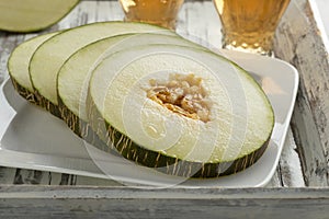 Sliced Piel de Sapo melon photo