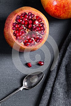 Sliced pomegranate with juicy red grains