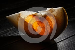 sliced pomelo on wood