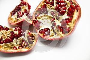 Sliced pommegranate on the white background